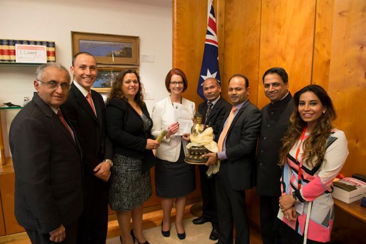 Prime Minister Julia Gillard with the Buddha and the letter
