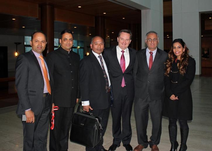 The Minister for Immigration and Citizenship Chris Bowen with the team